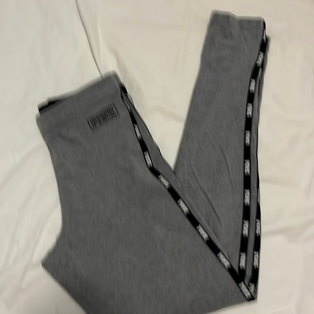 Pink logo leggings great condition- grey w black trim size small